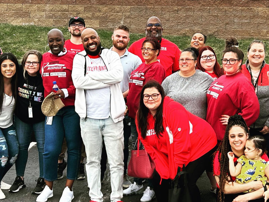 Signature Performance team gathered together at a community volunteer event