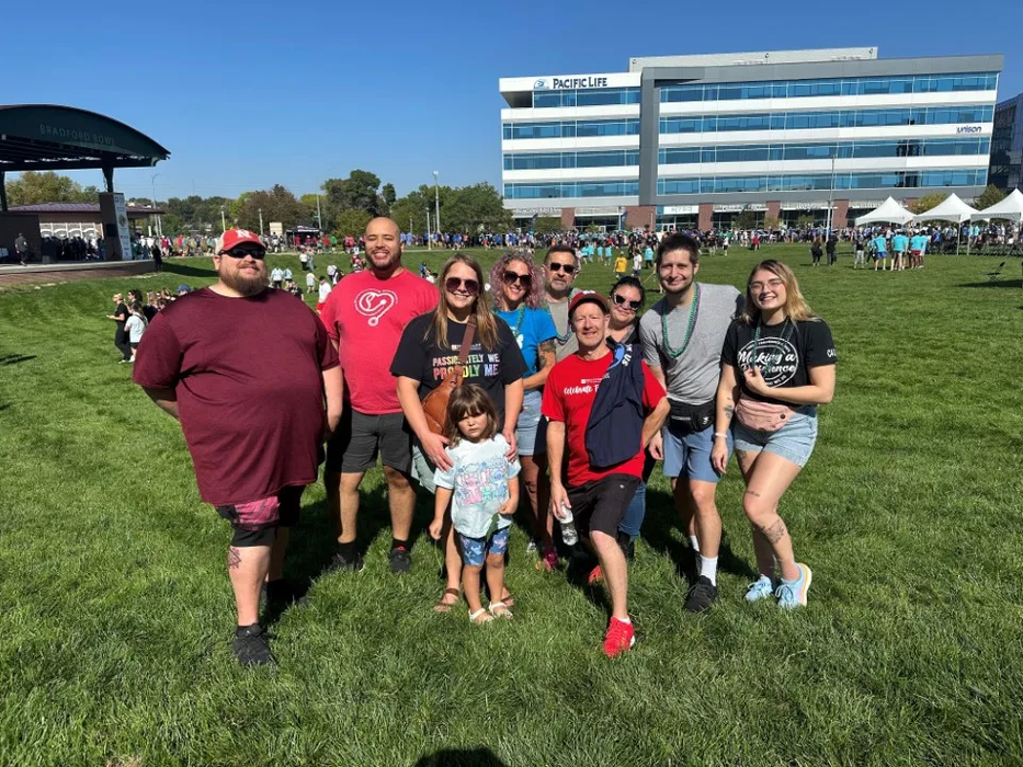 Signature Performance team gathered outdoors at a community fundraising event